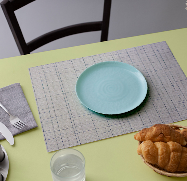 Fine Weave Ocean Mist Placemat styled on a dining table