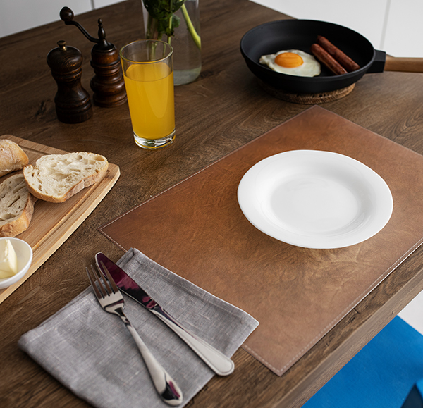Tan Placemat styled with white tableware